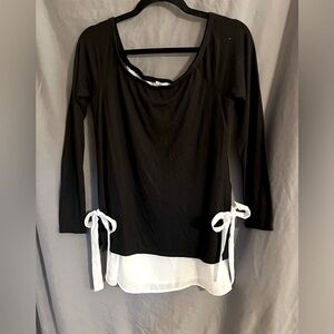 Maurice’s black sweater with white accents.